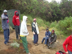 Porters waiting to break camp