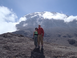 Dave & KK at the top of breakfast wall - Kili backdrop